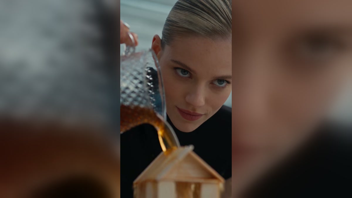 A dramatized scene showing liquid poured over a handmade wooden model