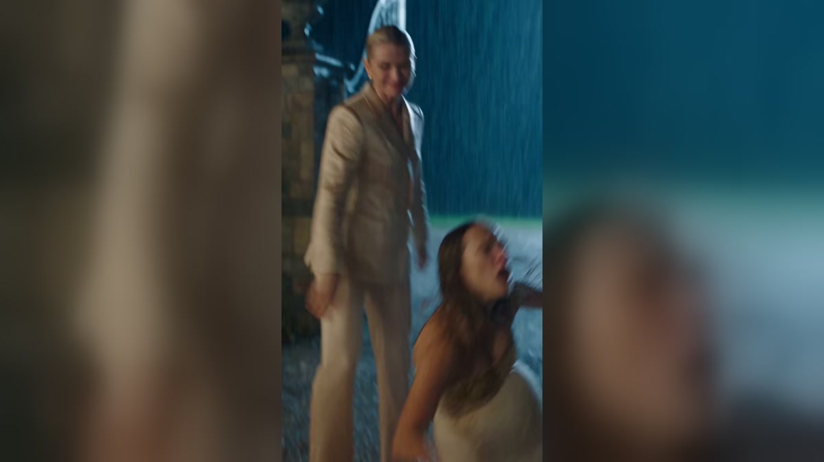 A dramatized rainy driveway confrontation