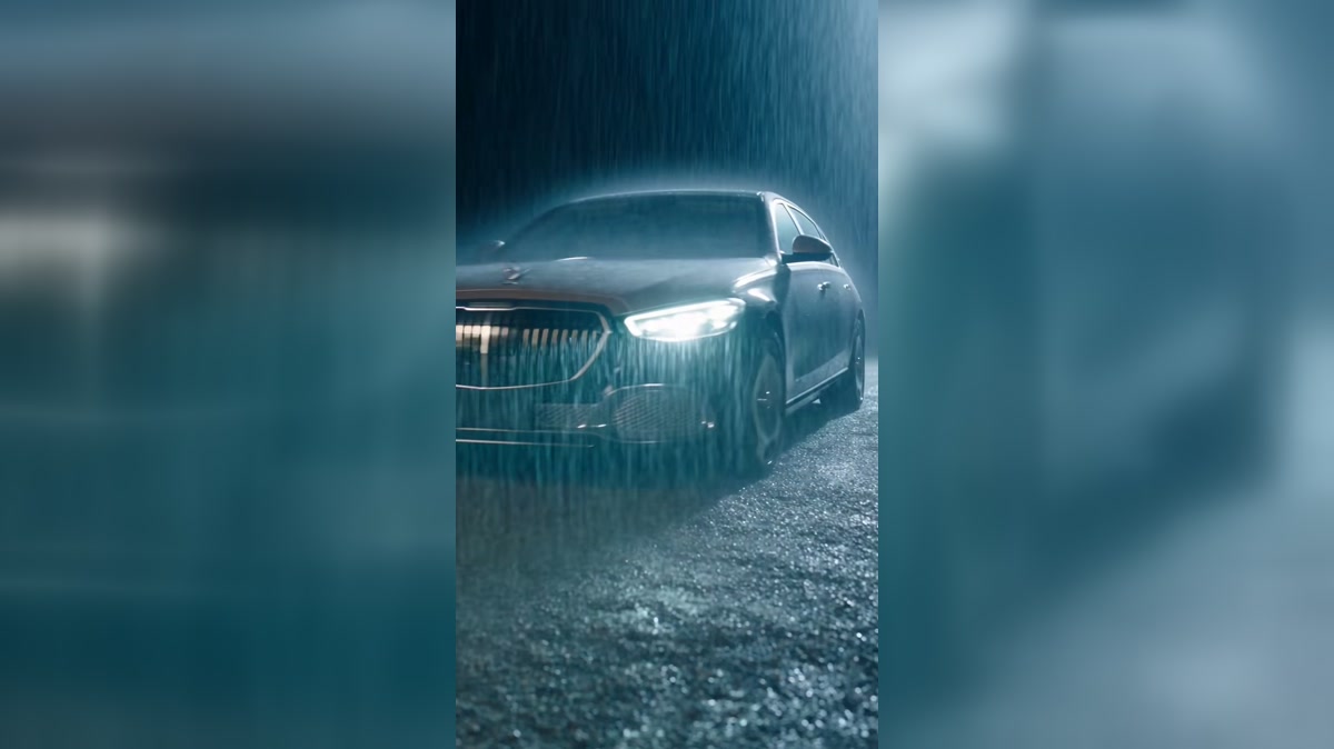 A car arrives during a storm as help reaches a woman on a driveway